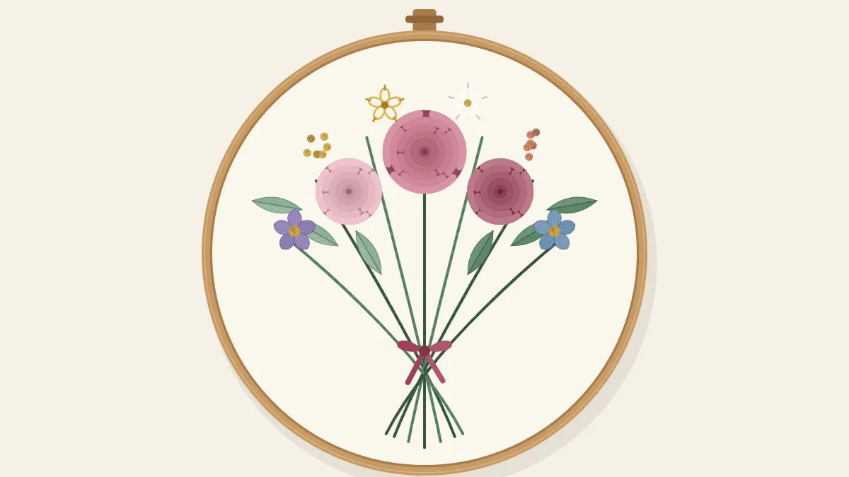 A hand-tied bouquet of mixed flowers with crossed stems and a ribbon bow, stitched inside an embroidery hoop