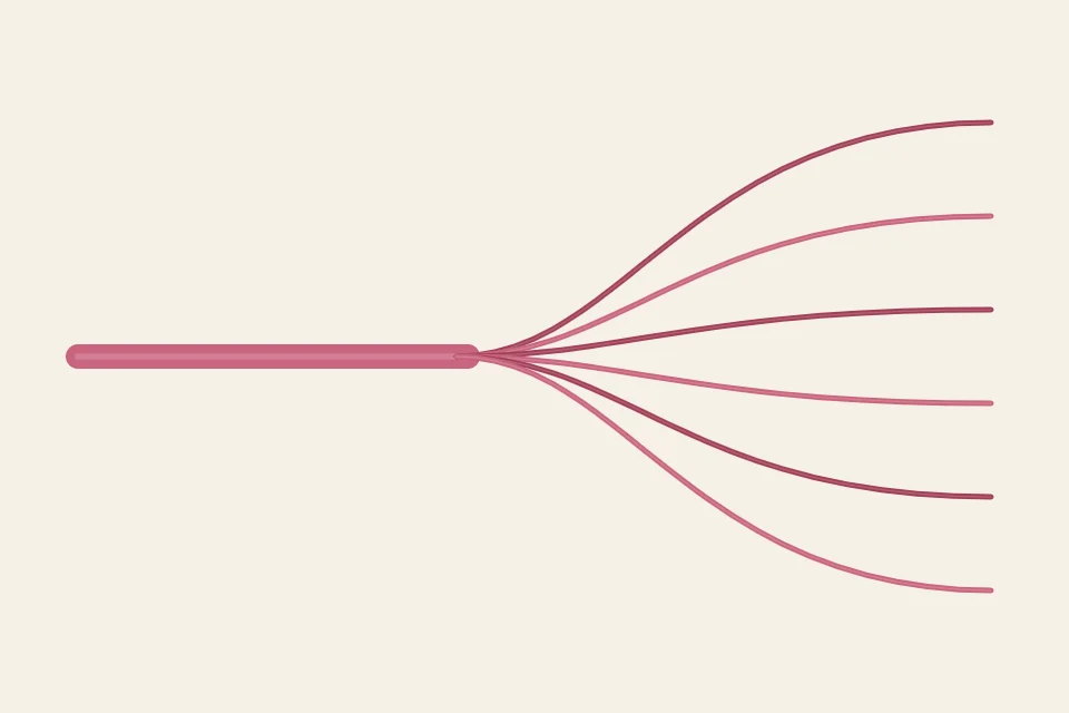 One cut length of six-strand floss separating at the top into six single strands that fan apart