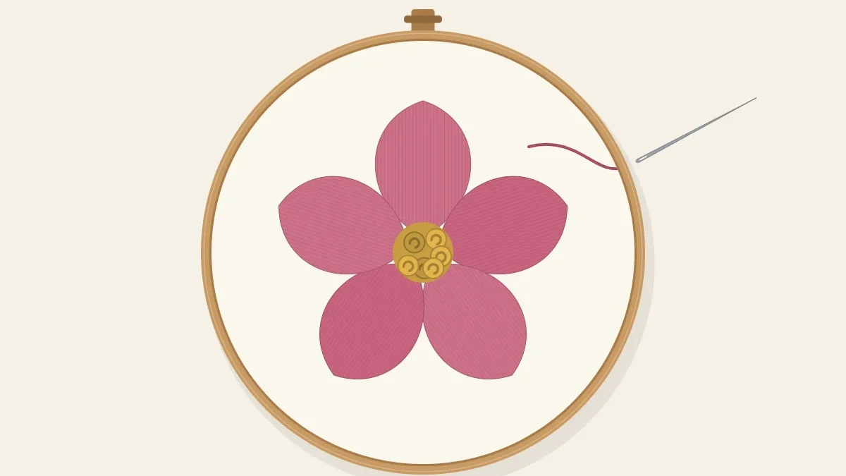 A five-petal flower filled with smooth satin stitch, with a needle finishing the last petal